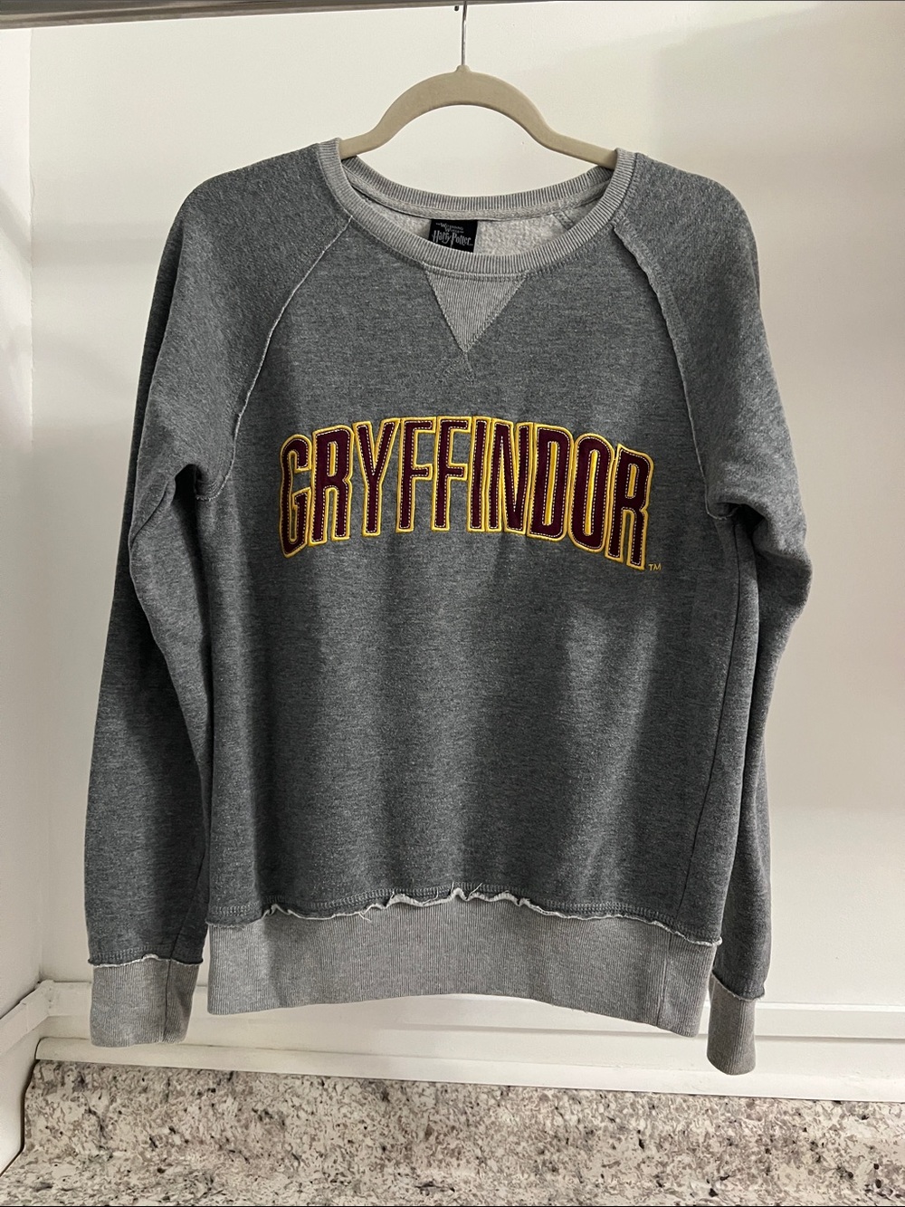 Universal Gray Crewneck Sweatshirt with Gryffindor Logo